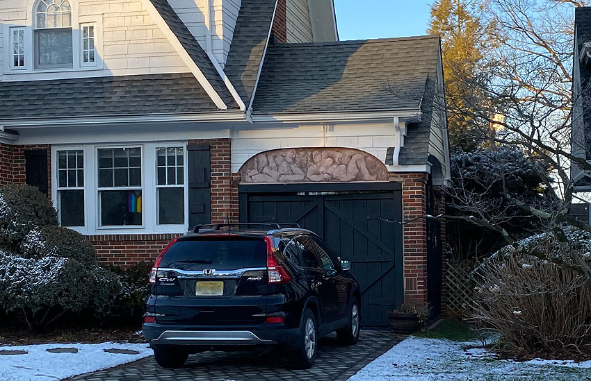 artistic garage in NJ with relief sculpture two reclining nudes
