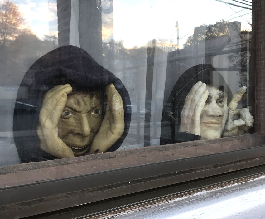 Creepy faces in the window of the Llewellyn Hotel in West Orange.