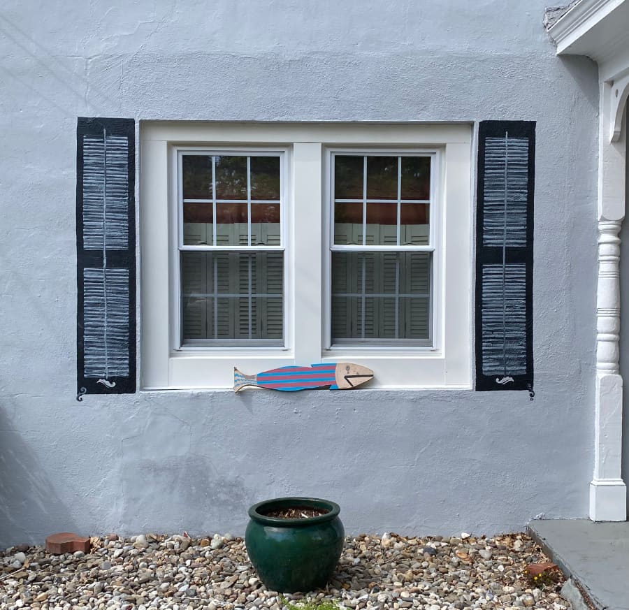 faux painted shutters on windows in Lambertville