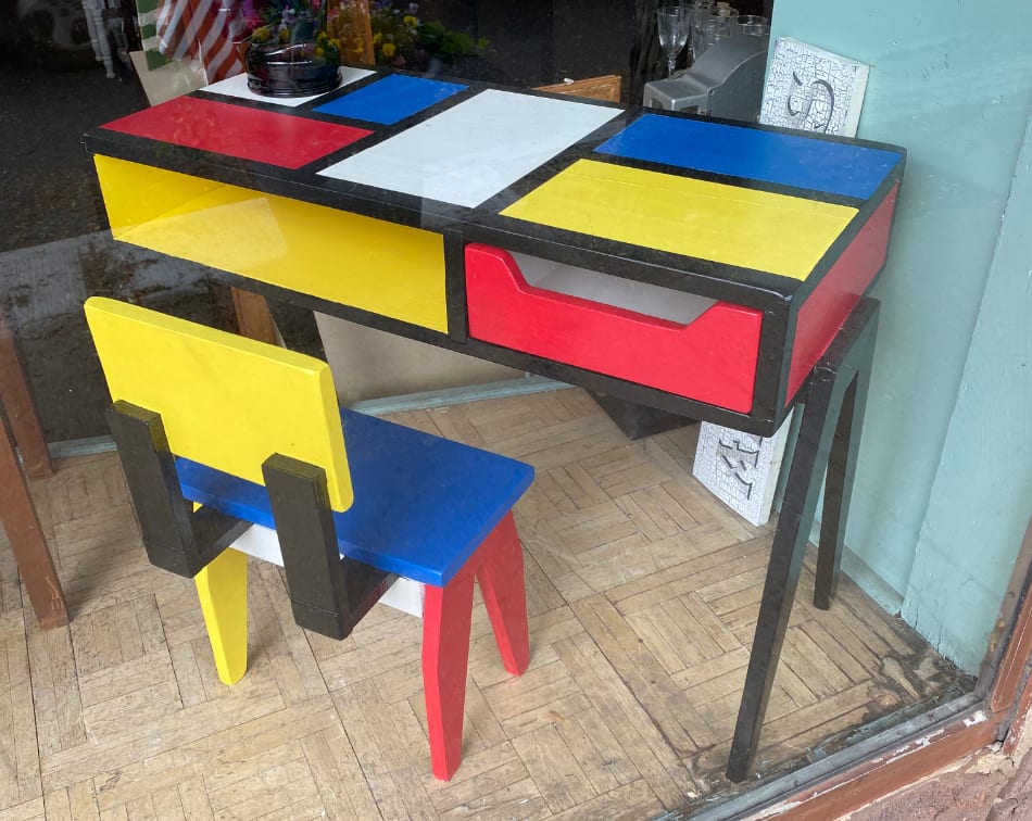 A Mondrian-style desk for kids at an antiques store