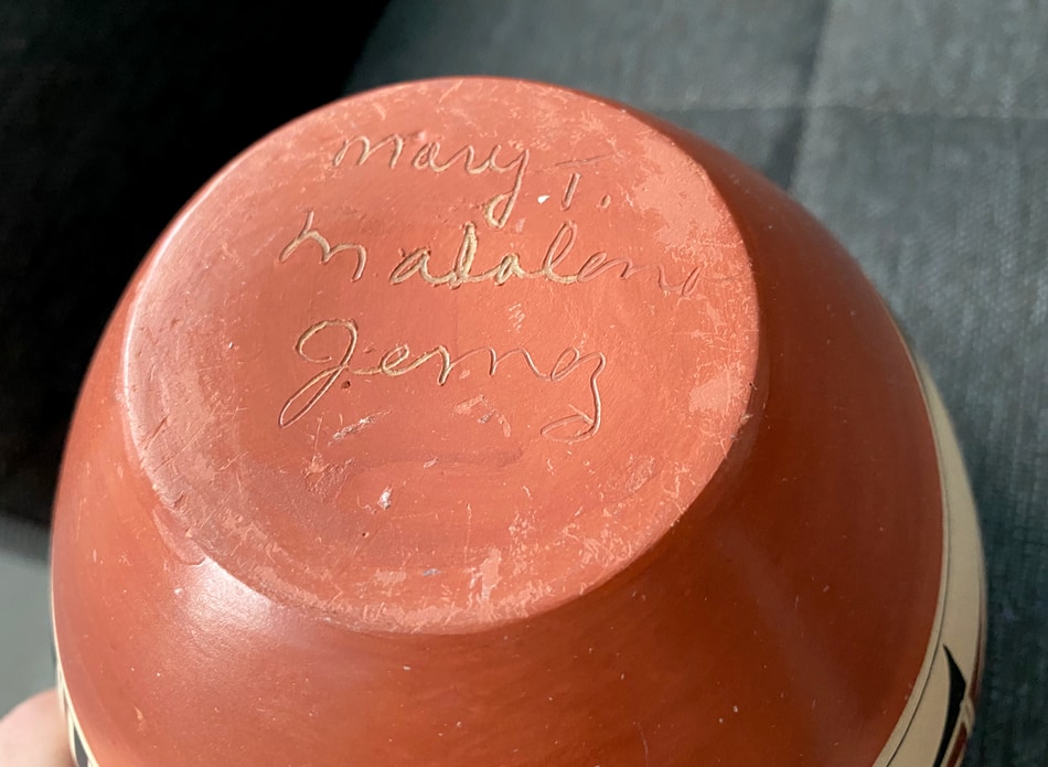 Signature on the bottom of a Native American pottery piece: Mary T. Madalena, Jemez