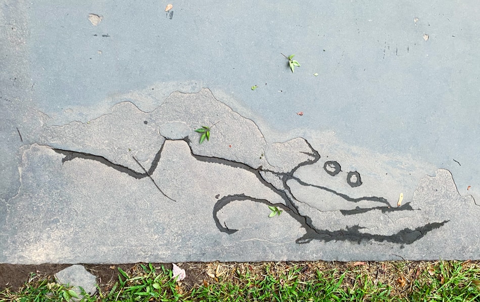 abstract art seen on a slate sidewalk