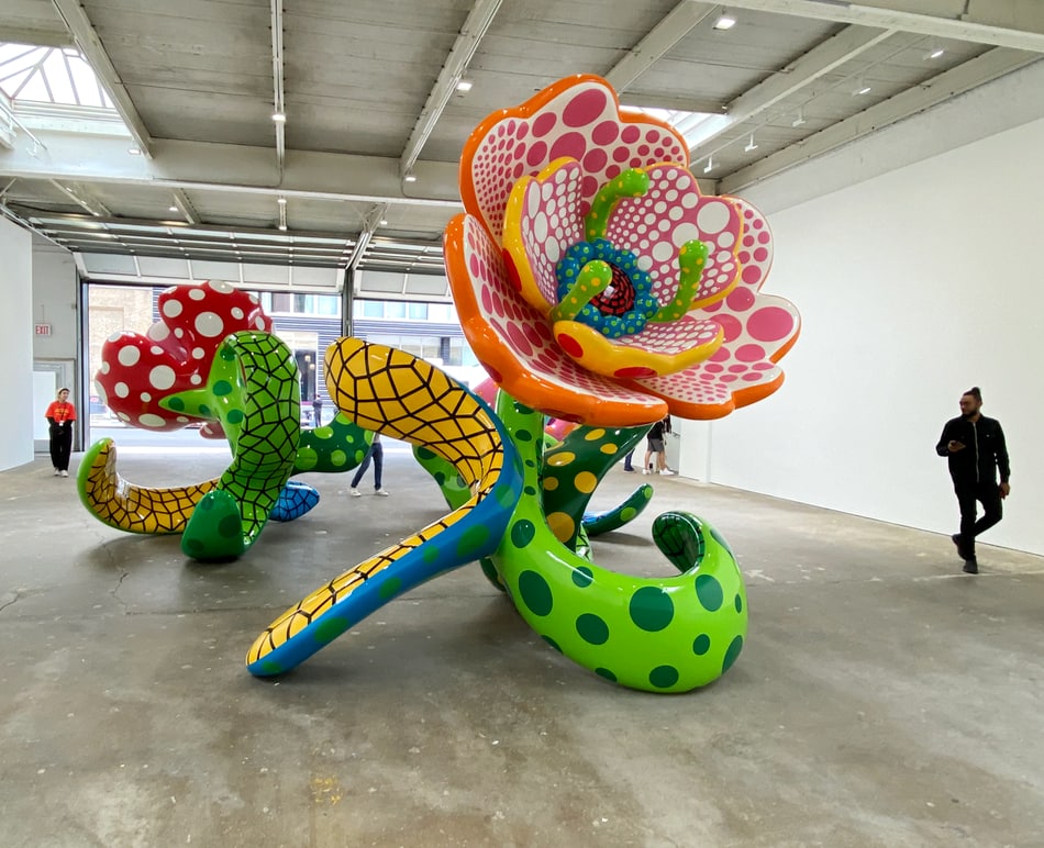 Installation view of Yayoi Kusama flower sculptures at David Zwirner Gallery.