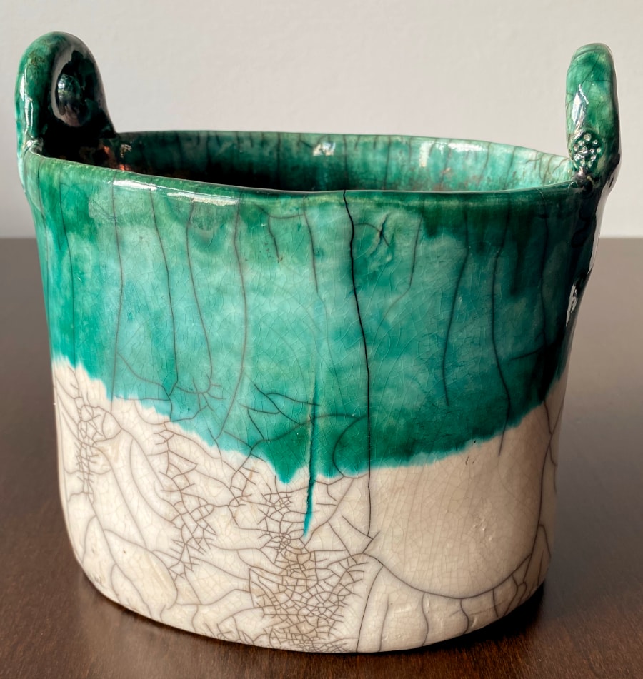 Up close view of cracking on raku pottery.