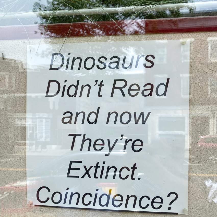 funny sign about dinosaurs not being able to read
