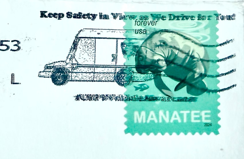A USPS Manatee stamp that appears next to a truck
