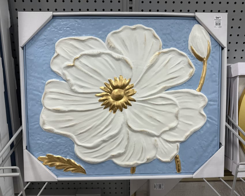 A plastic surface flower wall art piece.