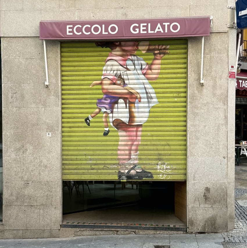 street art on an Eccolo Gelato gate in Madrid
