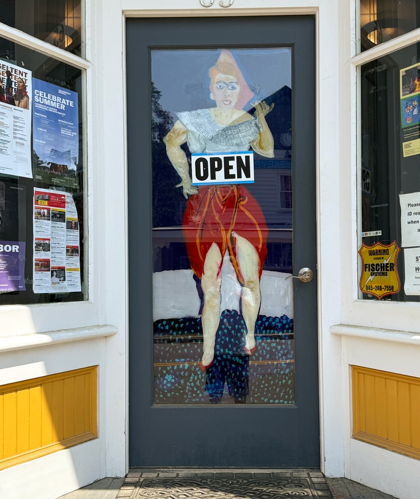 A woman on the door at Tivoli Wine and Spirits