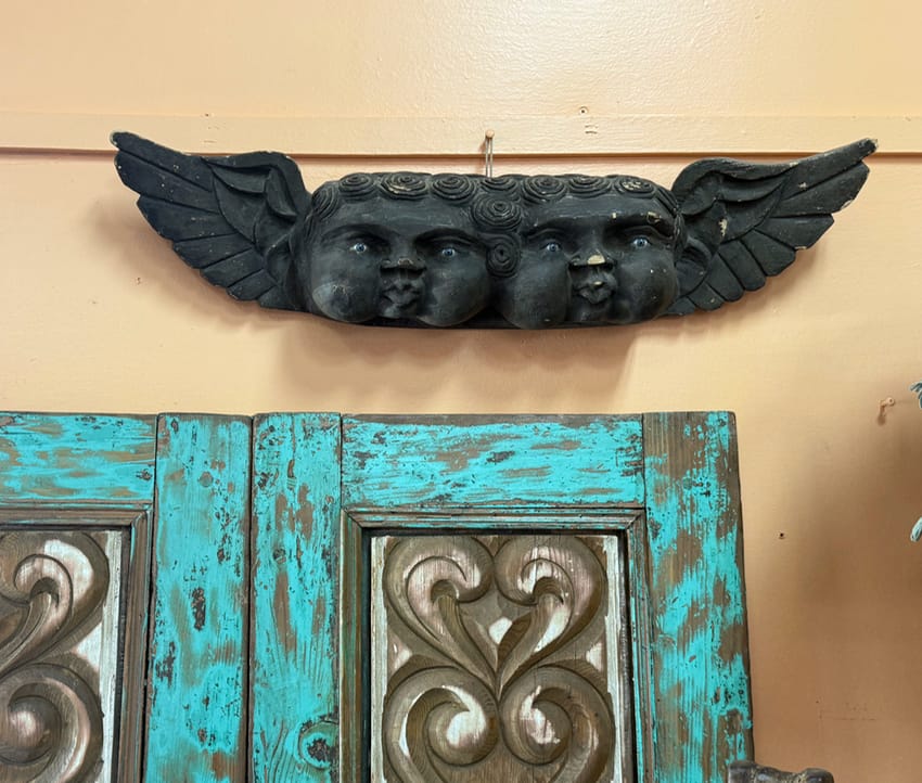 Double headed angel carved in wood