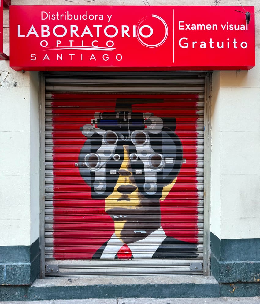 Mural on the security gate at Optica Santiago Mx in Mexico City.