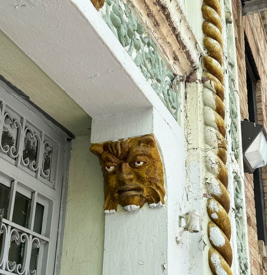 mascaron to ward off evil spirits on a building in NYC