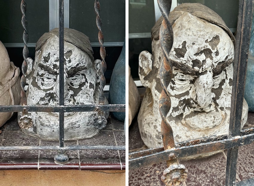 Two views of a sculpted head in a window as seen in Madrid, Spain.